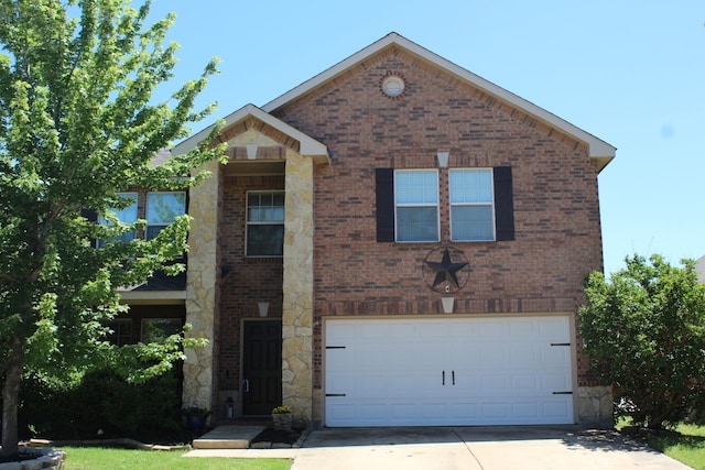 traditional-style home with concrete driveway, brick siding, and an attached garage