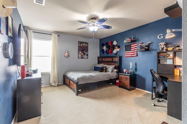 bedroom with baseboards, carpet flooring, ceiling fan, and visible vents