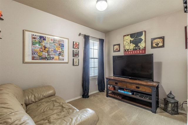 carpeted living area with baseboards