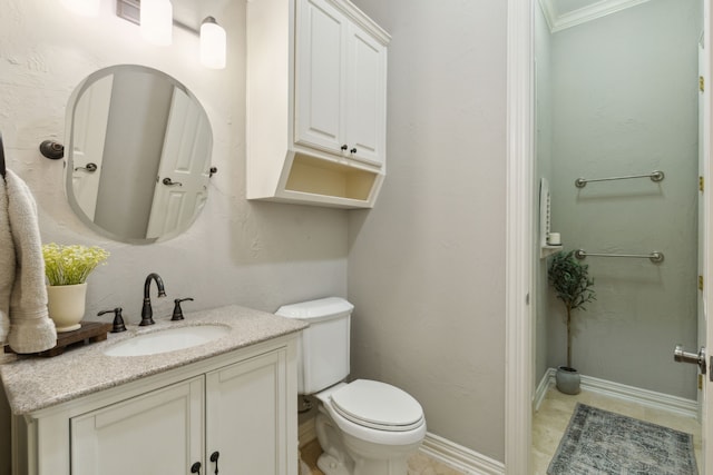 bathroom featuring toilet, vanity, baseboards, and ornamental molding