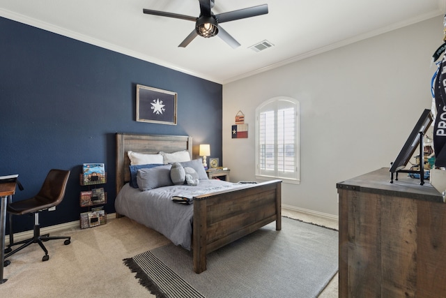 bedroom with visible vents, crown molding, baseboards, carpet flooring, and a ceiling fan