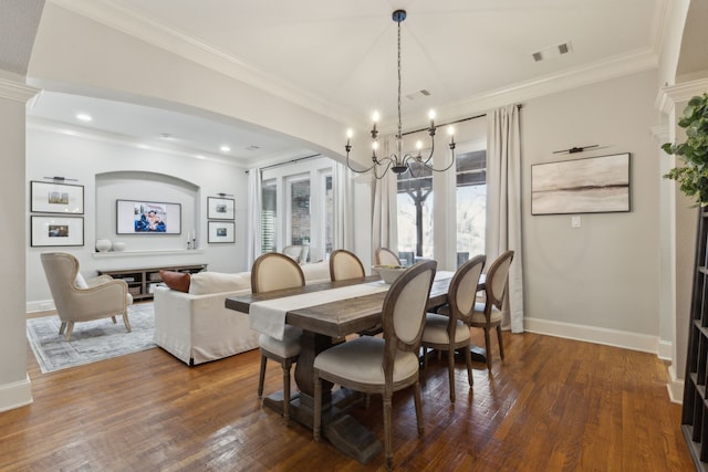 dining space with visible vents, baseboards, an inviting chandelier, dark wood-style flooring, and crown molding