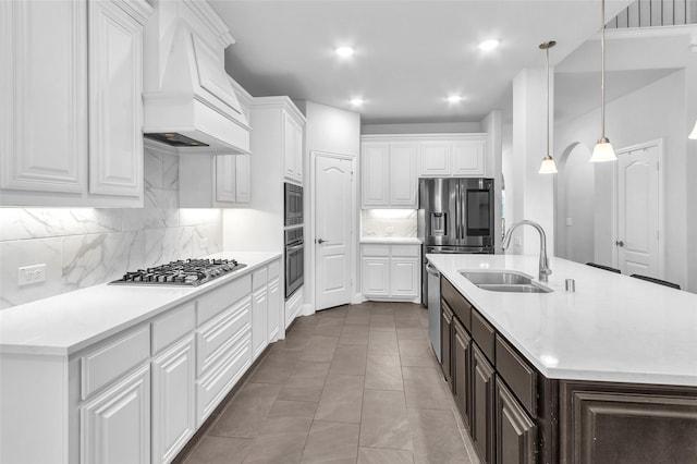 1411 Fishergate Dr, Forney, TX 75126 - kitchen featuring premium range hood, a sink, stainless steel appliances, white cabinetry, and dark brown cabinets