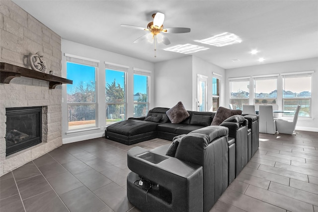1411 Fishergate Dr, Forney, TX 75126 - tiled living area featuring a ceiling fan and a fireplace
