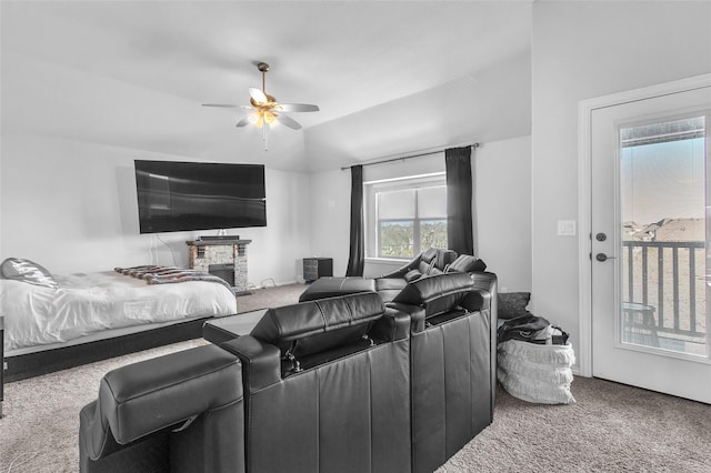 1411 Fishergate Dr, Forney, TX 75126 - carpeted home theater room featuring a ceiling fan and a stone fireplace