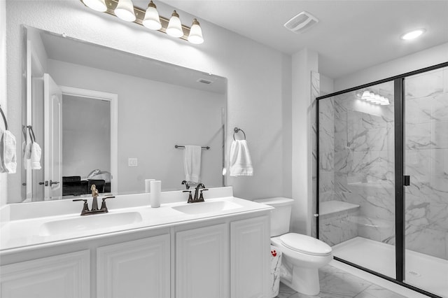 1411 Fishergate Dr, Forney, TX 75126 - bathroom featuring marble finish floors, a marble finish shower, double vanity, toilet, and recessed lighting