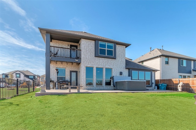 1411 Fishergate Dr, Forney, TX 75126 - rear view of house with a hot tub, a balcony, a patio, and a shingled roof