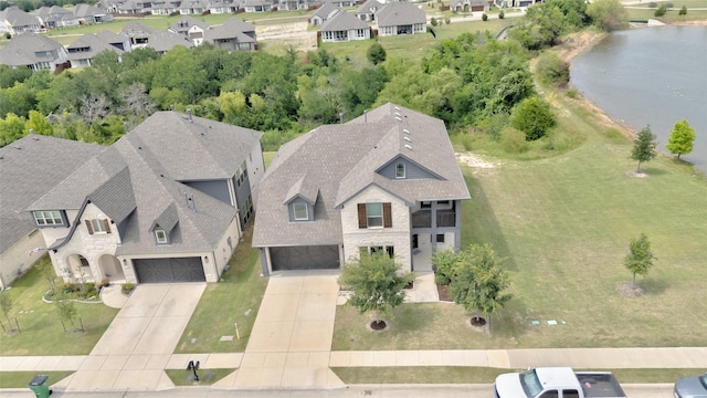 1411 Fishergate Dr, Forney, TX 75126 - aerial perspective of suburban area with a nearby body of water