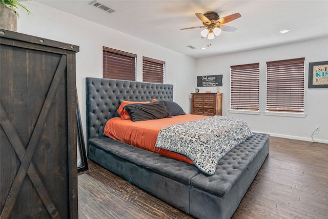 bedroom featuring recessed lighting, wood finished floors, visible vents, and baseboards