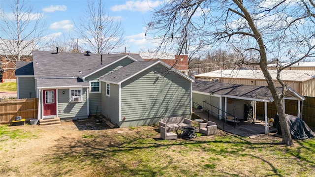 rear view of property featuring cooling unit, fence, roof with shingles, entry steps, and a lawn