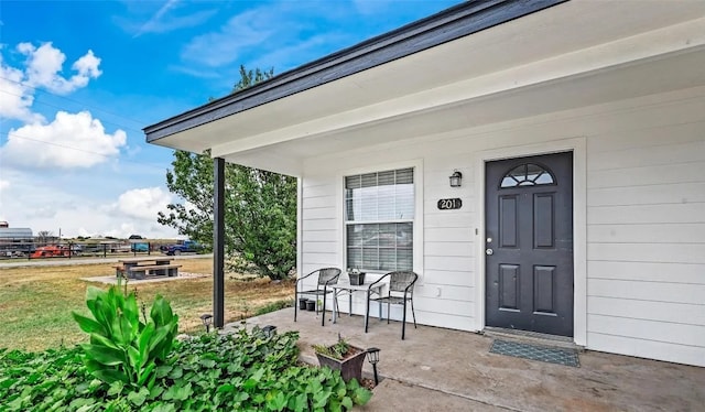 doorway to property featuring a yard