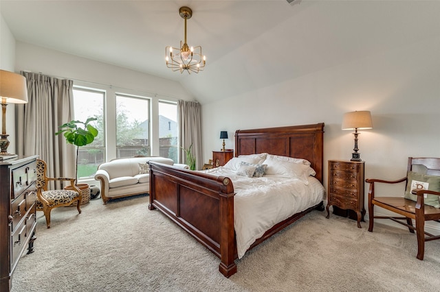 bedroom featuring a notable chandelier, lofted ceiling, and light colored carpet