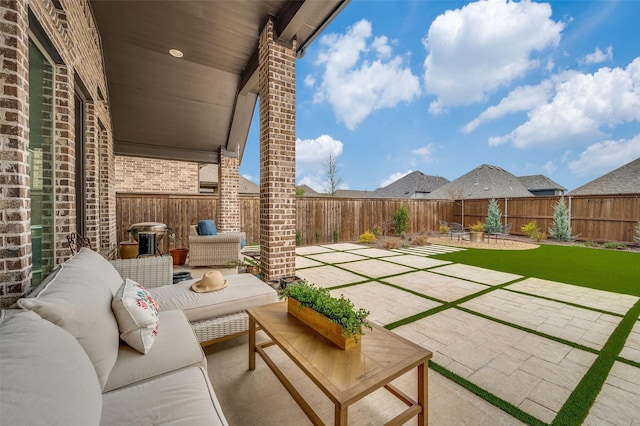 view of patio / terrace with a fenced backyard and an outdoor hangout area