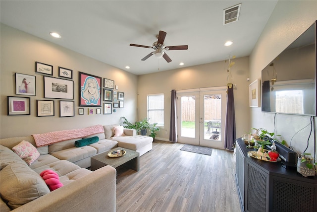 living area featuring visible vents, ceiling fan, recessed lighting, french doors, and light wood-style floors