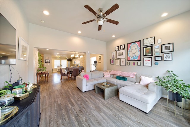 living room featuring recessed lighting, a ceiling fan, and wood finished floors