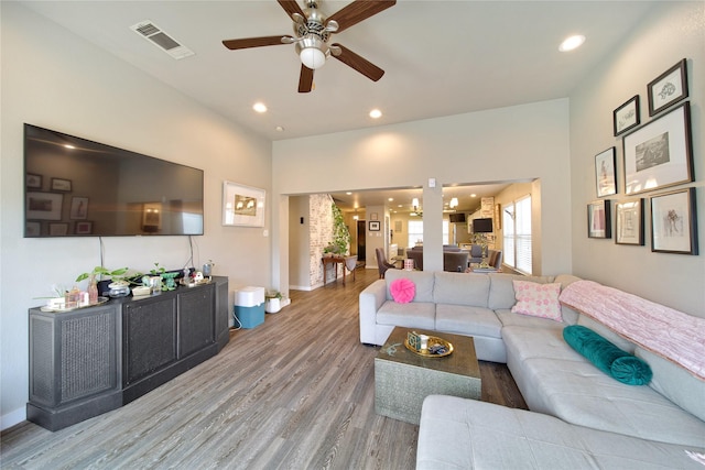 living room with recessed lighting, visible vents, wood finished floors, and a ceiling fan