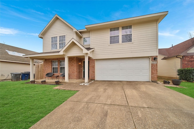 traditional-style home with brick siding, an attached garage, concrete driveway, and a front yard