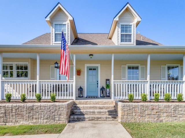 206 Cocopa Dr, Lake Kiowa, TX 76240 - view of front of property featuring covered porch and a shingled roof