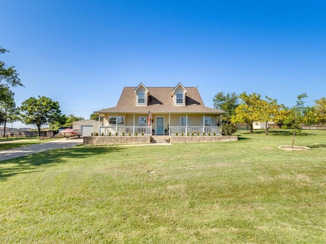206 Cocopa Dr, Lake Kiowa, TX 76240 - view of front of house with covered porch, driveway, a detached garage, and a front lawn