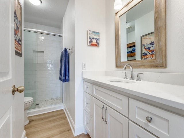 206 Cocopa Dr, Lake Kiowa, TX 76240 - bathroom with toilet, vanity, a shower stall, and wood finished floors