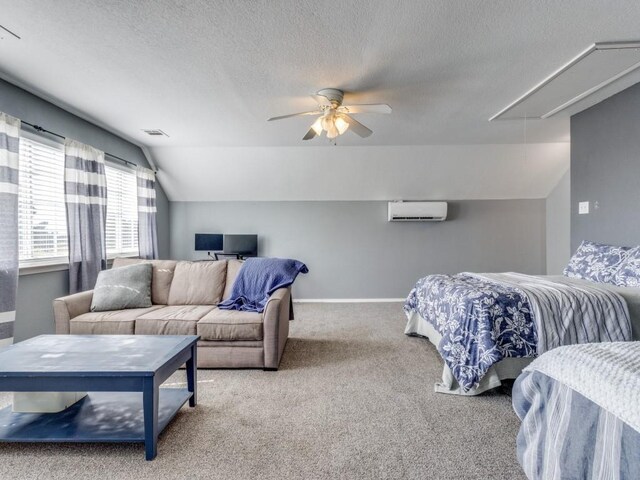 206 Cocopa Dr, Lake Kiowa, TX 76240 - bedroom with attic access, a wall unit AC, lofted ceiling, carpet floors, and a textured ceiling