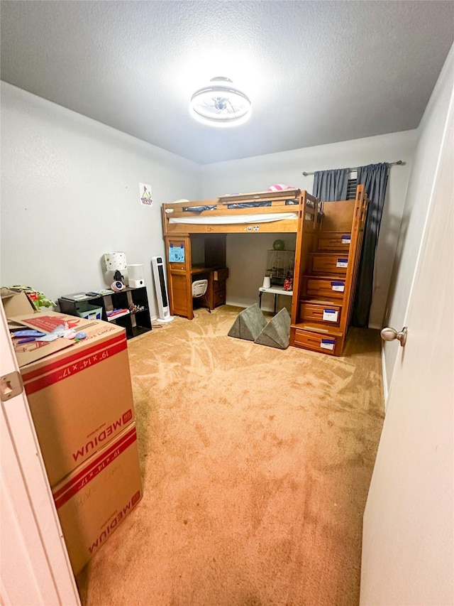 carpeted bedroom featuring a textured ceiling