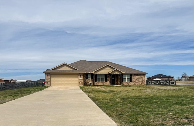 view of front of home with a shingled roof, a front lawn, fence, a garage, and driveway