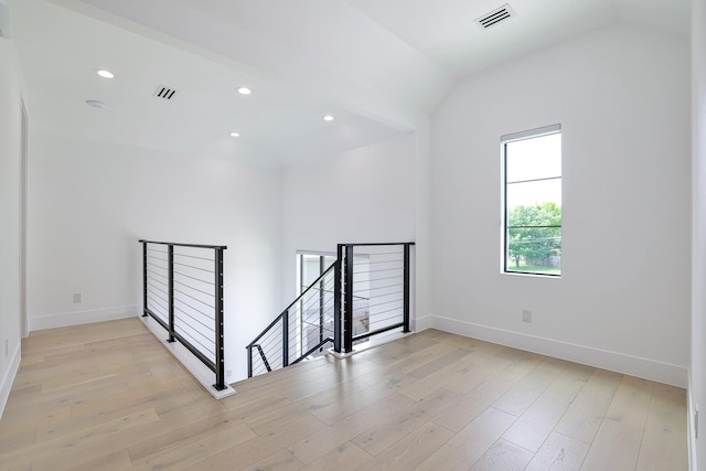 1733 E Lake Dr, Weatherford, TX 76087 - spare room featuring light wood-type flooring, visible vents, lofted ceiling, recessed lighting, and baseboards