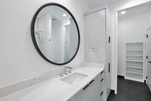 1733 E Lake Dr, Weatherford, TX 76087 - full bathroom featuring tile patterned flooring, recessed lighting, and vanity