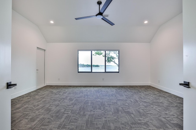 1733 E Lake Dr, Weatherford, TX 76087 - spare room with dark colored carpet, baseboards, lofted ceiling, and ceiling fan