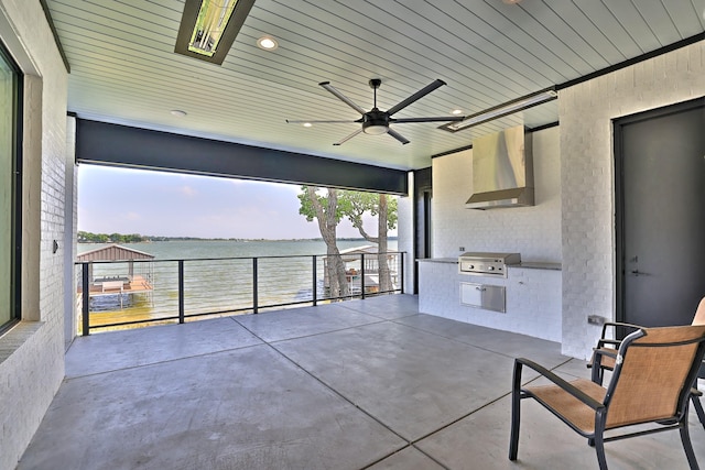 1733 E Lake Dr, Weatherford, TX 76087 - view of patio / terrace with ceiling fan, a water view, a grill, and an outdoor kitchen