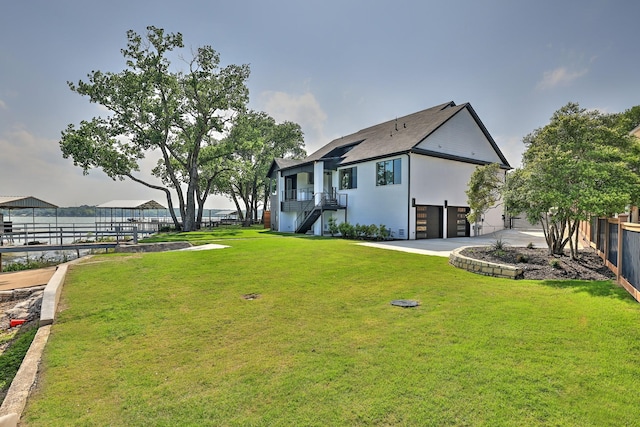 1733 E Lake Dr, Weatherford, TX 76087 - view of yard featuring driveway, an attached garage, stairs, and fence