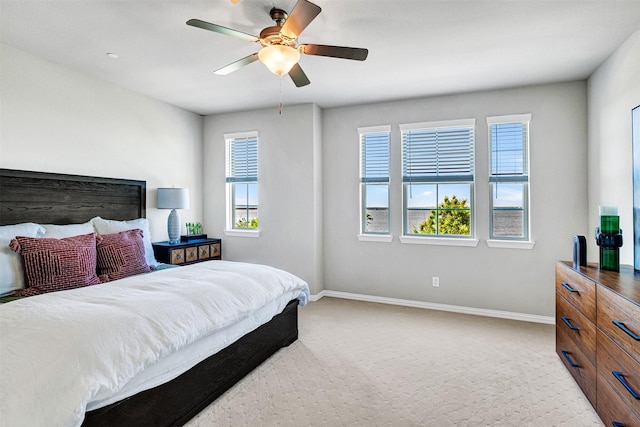bedroom with baseboards, carpet flooring, and ceiling fan