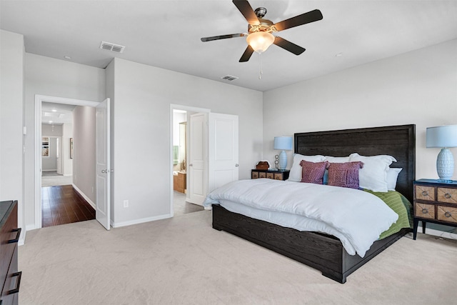 bedroom with ceiling fan, baseboards, visible vents, and carpet floors