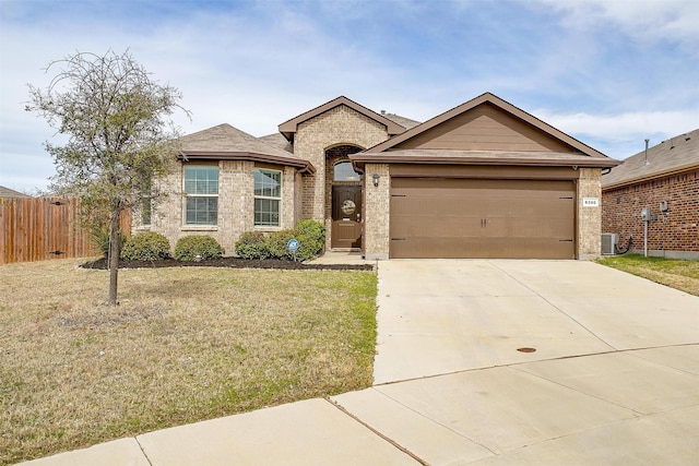 ranch-style house with brick siding, a front lawn, central air condition unit, a garage, and driveway