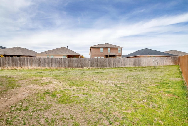 view of yard featuring a fenced backyard