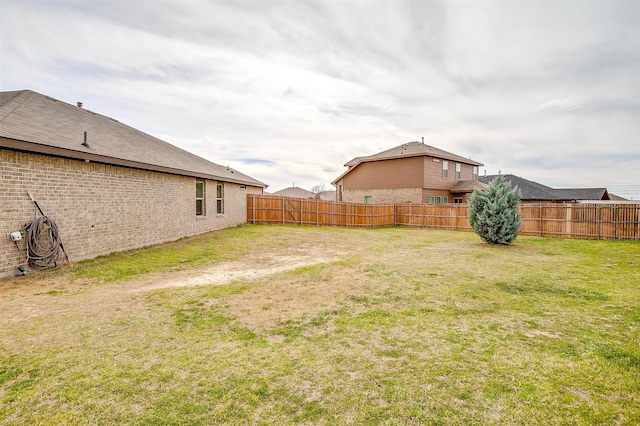 view of yard featuring a fenced backyard