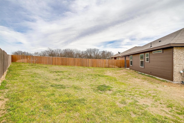 view of yard featuring a fenced backyard