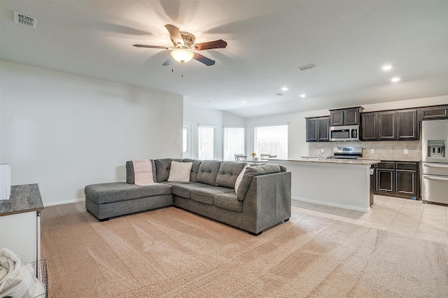 living area featuring visible vents, recessed lighting, light tile patterned flooring, baseboards, and ceiling fan