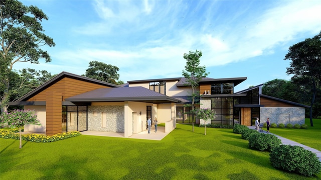 rear view of house featuring a yard, a patio area, stone siding, and stucco siding