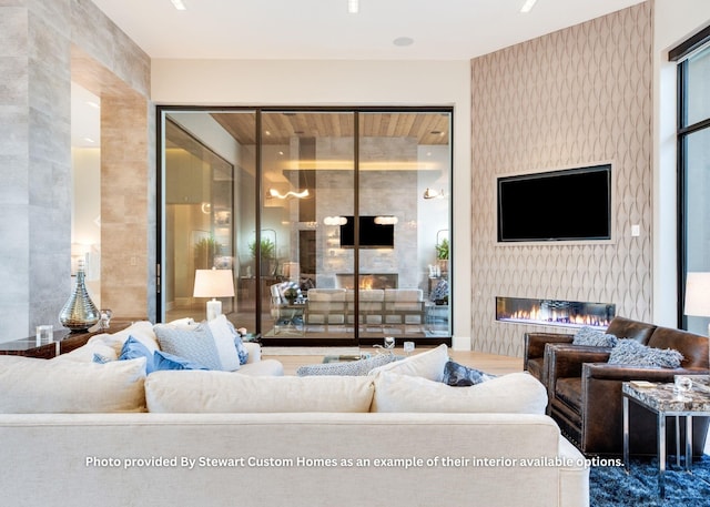 living room with a glass covered fireplace