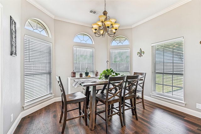 dining space featuring visible vents, baseboards, dark wood finished floors, ornamental molding, and an inviting chandelier