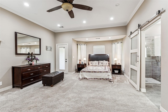 bedroom featuring a barn door, crown molding, baseboards, and carpet floors