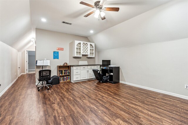 office space with visible vents, baseboards, lofted ceiling, ceiling fan, and dark wood-style flooring