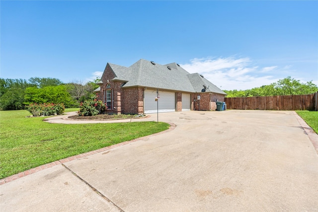 view of property exterior featuring a lawn, fence, concrete driveway, a garage, and brick siding