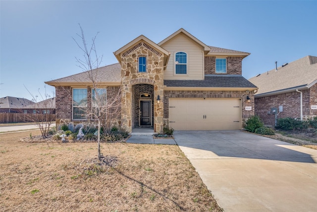 3943 Sidney Ln, Forney, TX 75126 - view of front of home with a garage, brick siding, concrete driveway, stone siding, and a shingled roof