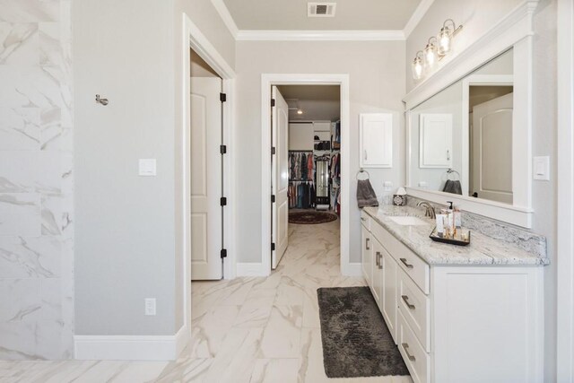 full bath with vanity, visible vents, baseboards, crown molding, and marble finish floor
