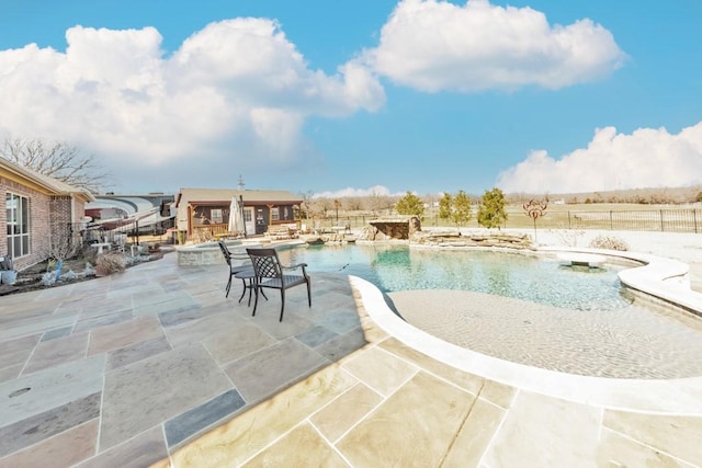 view of swimming pool with a patio area and a fenced in pool