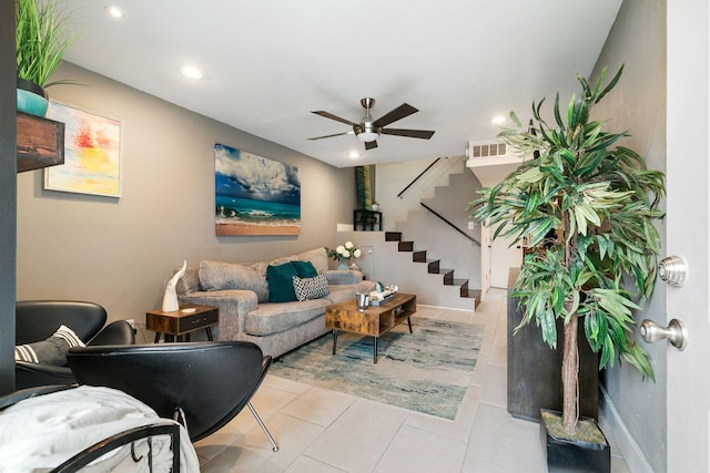 living room with visible vents, a ceiling fan, recessed lighting, tile patterned flooring, and stairs