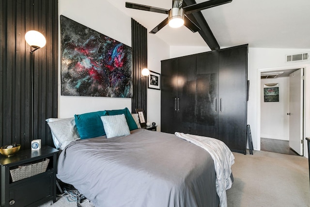 bedroom with visible vents, light carpet, beam ceiling, and a ceiling fan